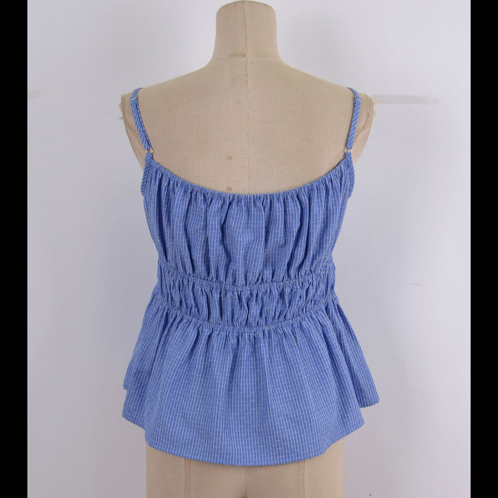 A blue and white gingham patterned camisole top with a smocked waist and thin shoulder straps, displayed on a beige fabric mannequin torso against a white background.