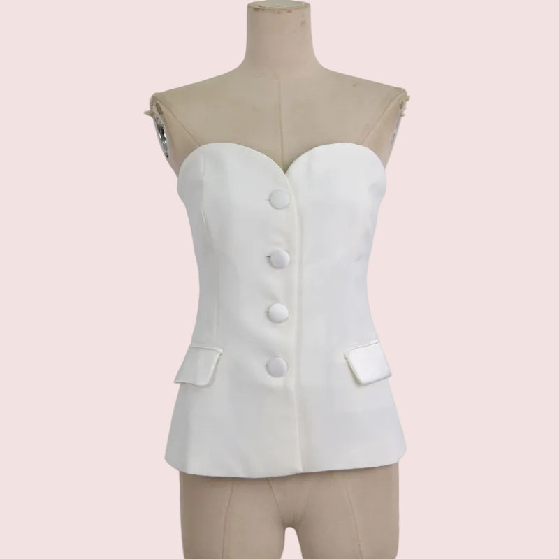 An off-white strapless corset-style top with a sweetheart neckline, front buttons, and flap pockets, displayed on a beige dress form against a light gray background.