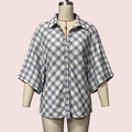 A short-sleeve plaid button-up shirt displayed on a mannequin torso against a pale pink background. The shirt has a white base with a blue and gray plaid pattern.