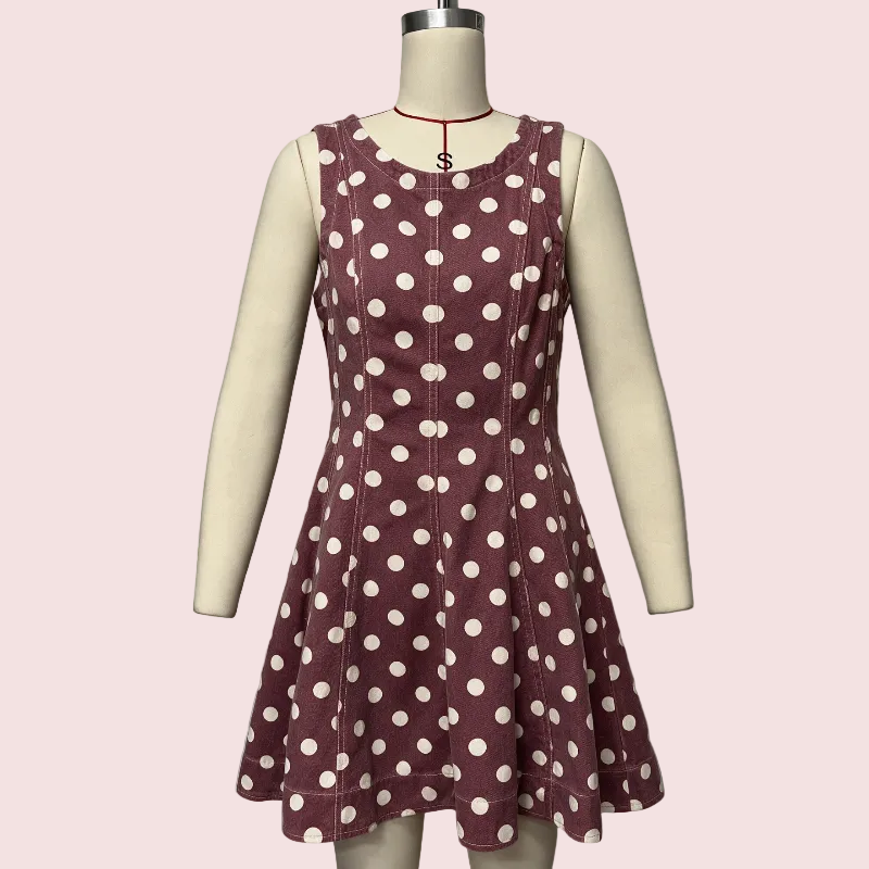 A sleeveless fit-and-flare dress with a scalloped neckline, featuring an allover polka dot pattern in white on a dusty mauve-brown base. The dress is displayed on a cream-colored mannequin against a solid pale pink background.