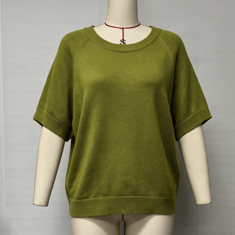 An olive green short-sleeve knit sweater displayed on a cream mannequin torso against a plain light gray background.