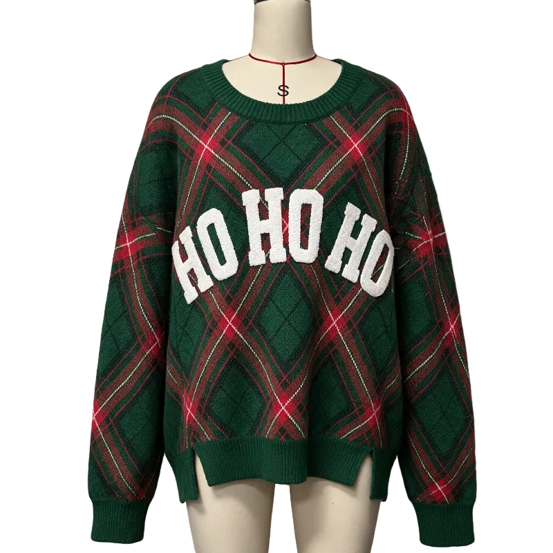 A green Christmas-themed knit sweater with a red and green plaid pattern and 'HO HO HO' in white letters across the chest, displayed on a mannequin.