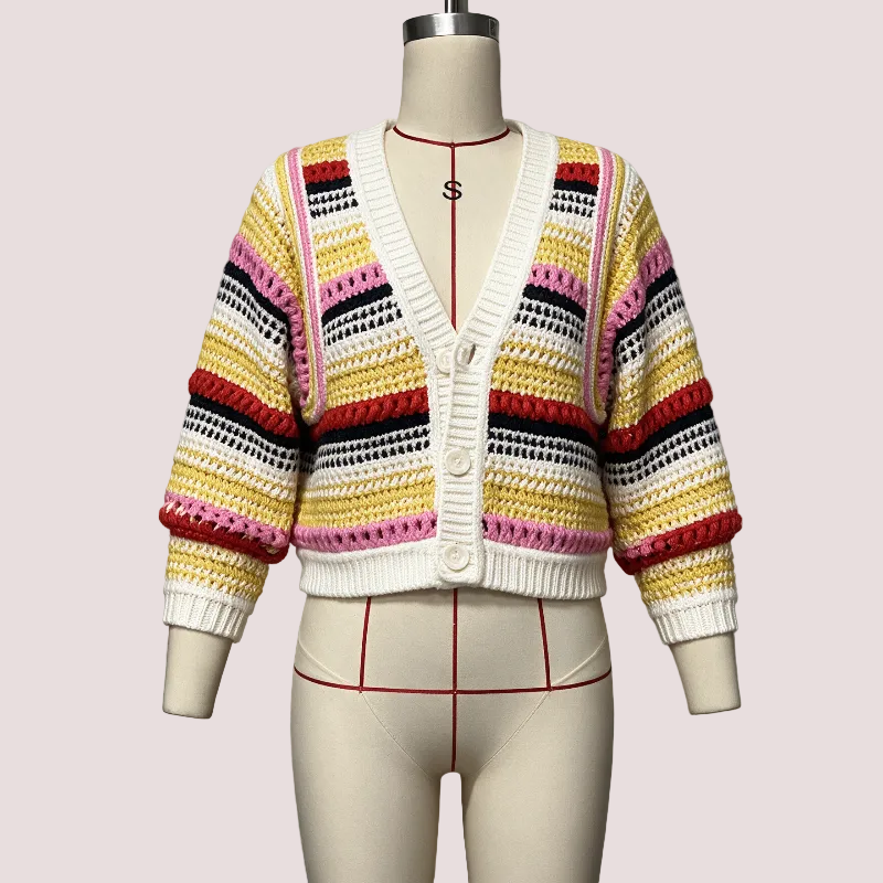 A multicolor striped crochet cardigan sweater displayed on a cream dress form mannequin. The cardigan features horizontal stripes of yellow, pink, red, black, and white, with a solid white ribbed V-neck, button closure, and cuffs.