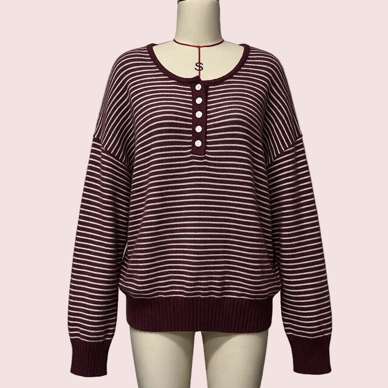 A long-sleeve knit sweater with horizontal burgundy and off-white stripes, featuring a buttoned henley neckline, displayed on a mannequin torso against a plain light gray background.