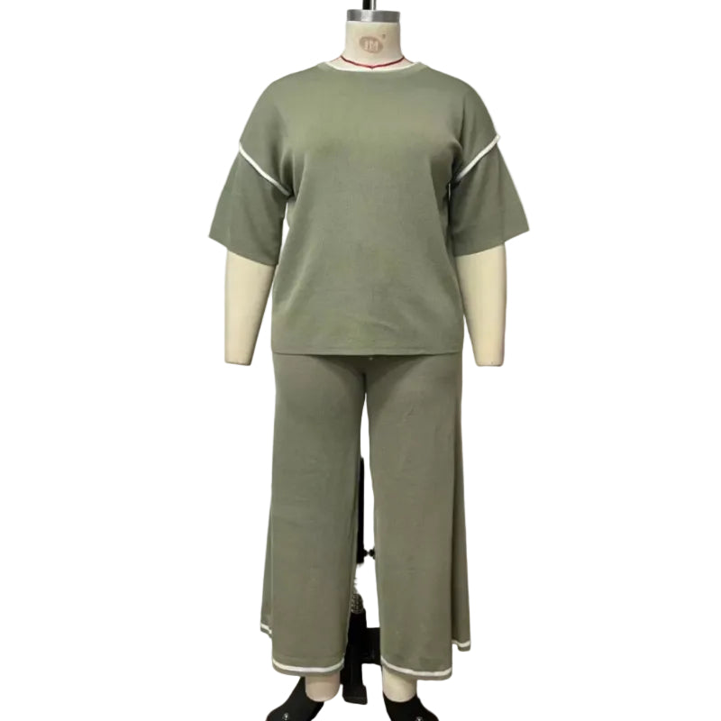 An olive green two-piece lounge set consisting of a short-sleeve top and matching wide-leg pants, displayed on a mannequin against a white wall.