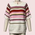 A knit short-sleeve sweater with horizontal stripes in cream, pink, red, olive green, and yellow, displayed on a mannequin torso against a gray background.