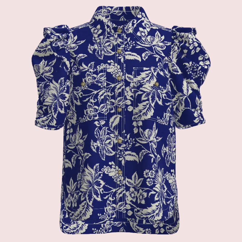 A short-sleeve button-up shirt with a bold blue and white floral print, featuring dramatic puffed shoulders and a classic collar, shown against a plain white background.